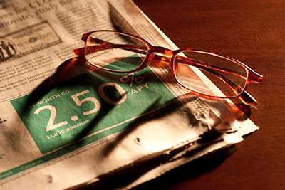 glasses on a newspaper