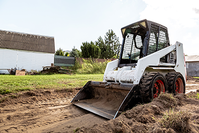 skid steer building a road